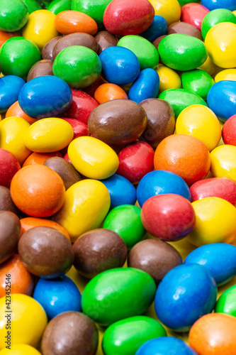 colored crunchy chocolate balls occupying the entire image