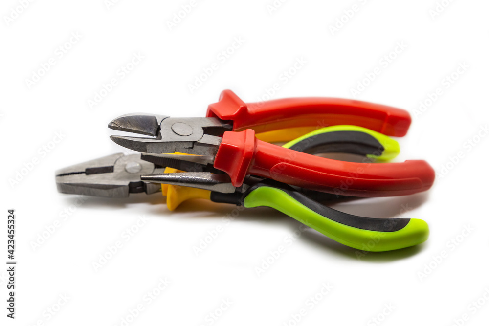Stack of working electrician hand tools piled in a stack on an isolated background Stack of working electrician hand tools piled in a stack on an isolated background