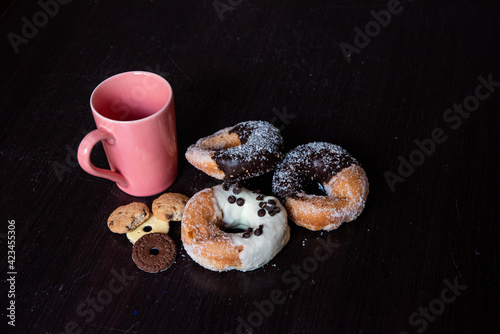 Having breakfast filled with chocolate and caramel donalds, white chocolate cream, and some cookies.  photo