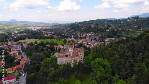 European castle and village old houses with red and orange colored roof. Beautiful historic landmark shot with drone aerial footage 4K 30fps.