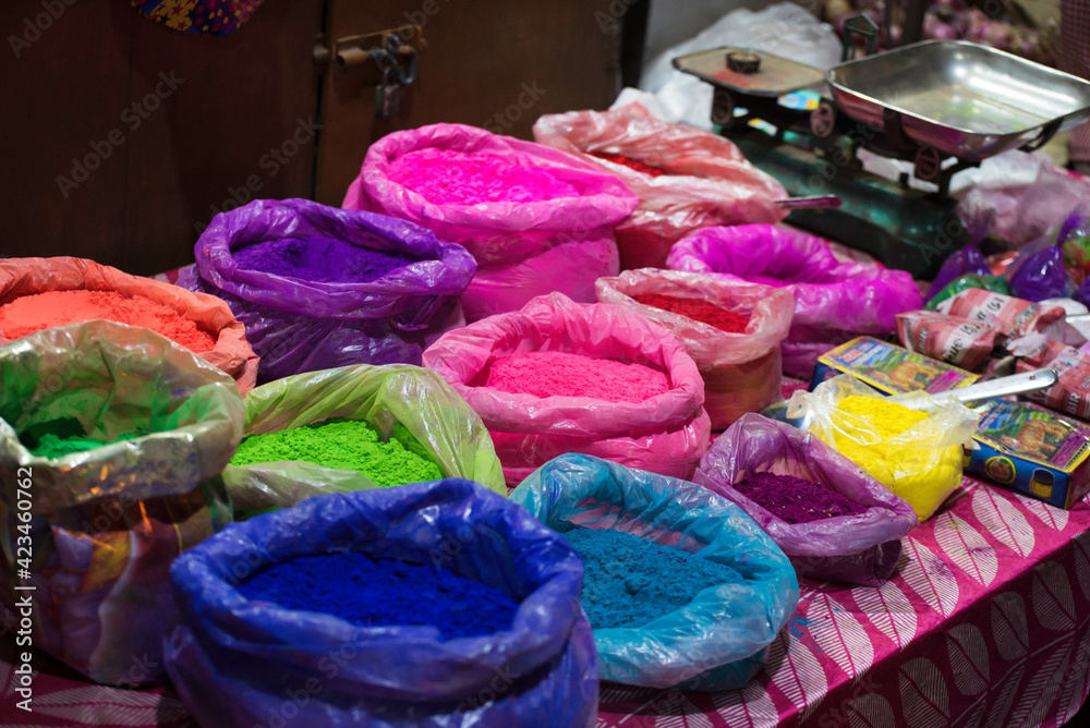 Fototapeta premium Exhibit colorful powder in a bag for sell for sell during Indian traditional festival holi
