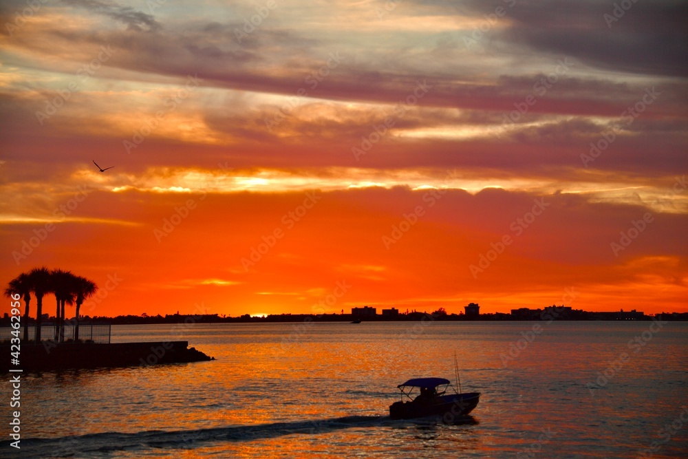 Sunset sky boat silhouette at sea beautiful landscape 