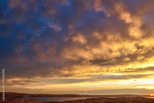 Sunset is full of colours over the rugged Island of Pag, Croatia.