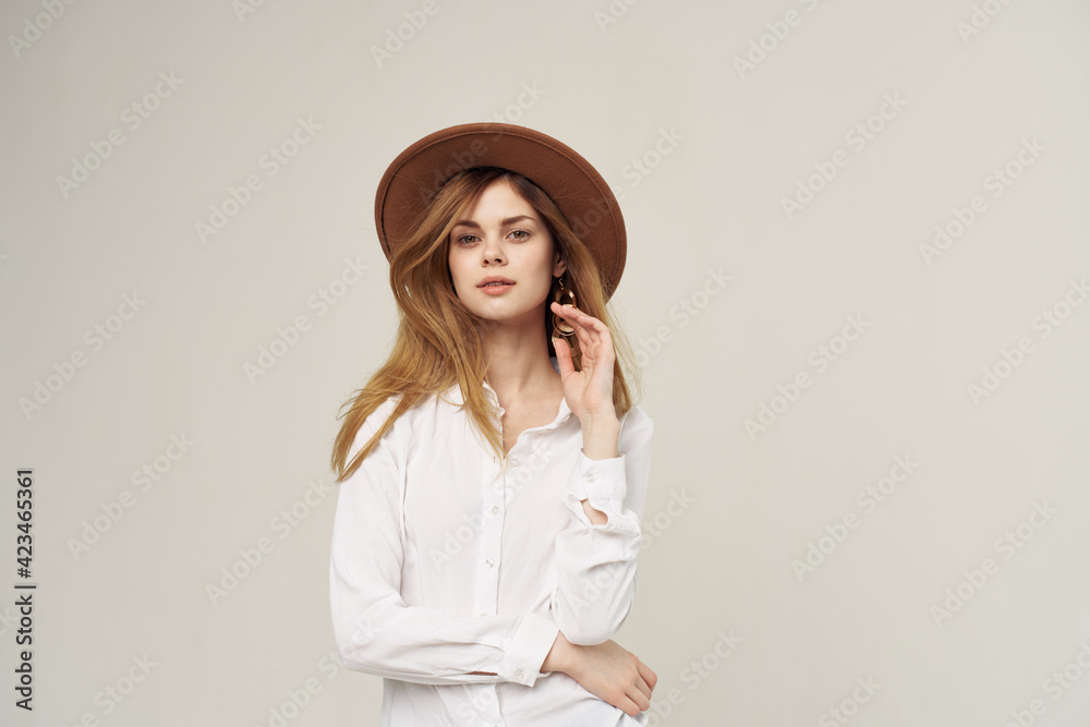 Woman with hat fashion street style clothes white shirt in close-up Woman with hat fashion street style clothes white shirt in close-up