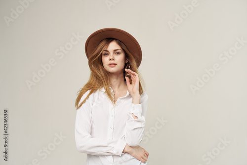 Woman with hat fashion street style clothes white shirt in close-up