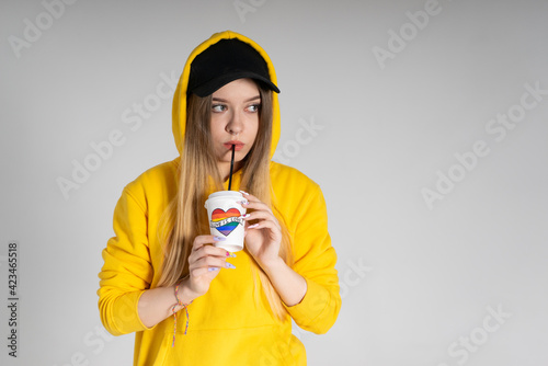 Woman with LGBT rainbow coffee cup