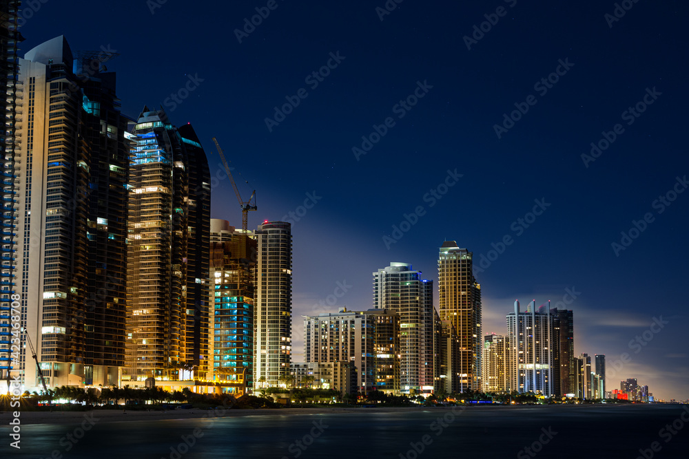 Sunny Isles Florida night sky line view from water.