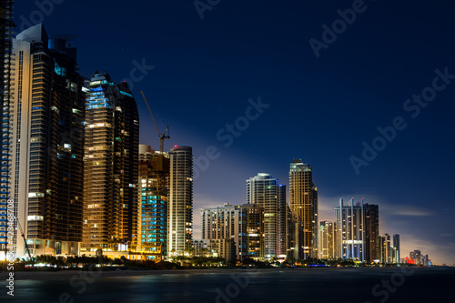 Sunny Isles Florida night sky line view from water.