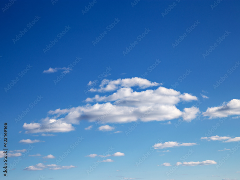 White clouds in blue skies on sunny spring day White clouds in blue skies on sunny spring day