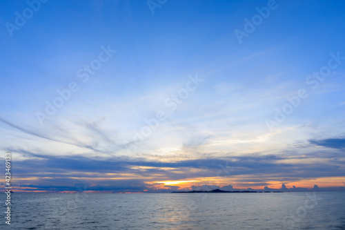 Evening or sunset time over the sea or ocean and island with water.