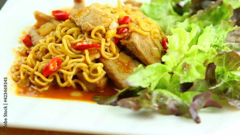 Stir-fried yellow noodle with chopped pork, in studio Chiangmai Thailand