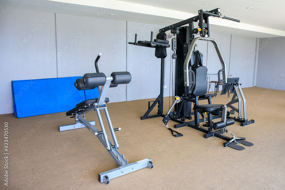 Gym equipment in gym room for exercise.