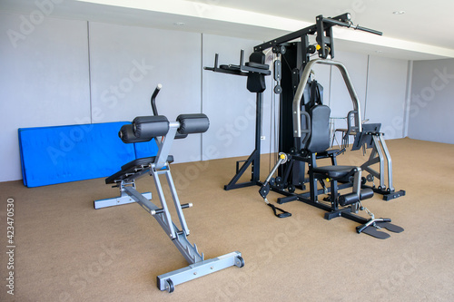 Gym equipment in gym room for exercise.