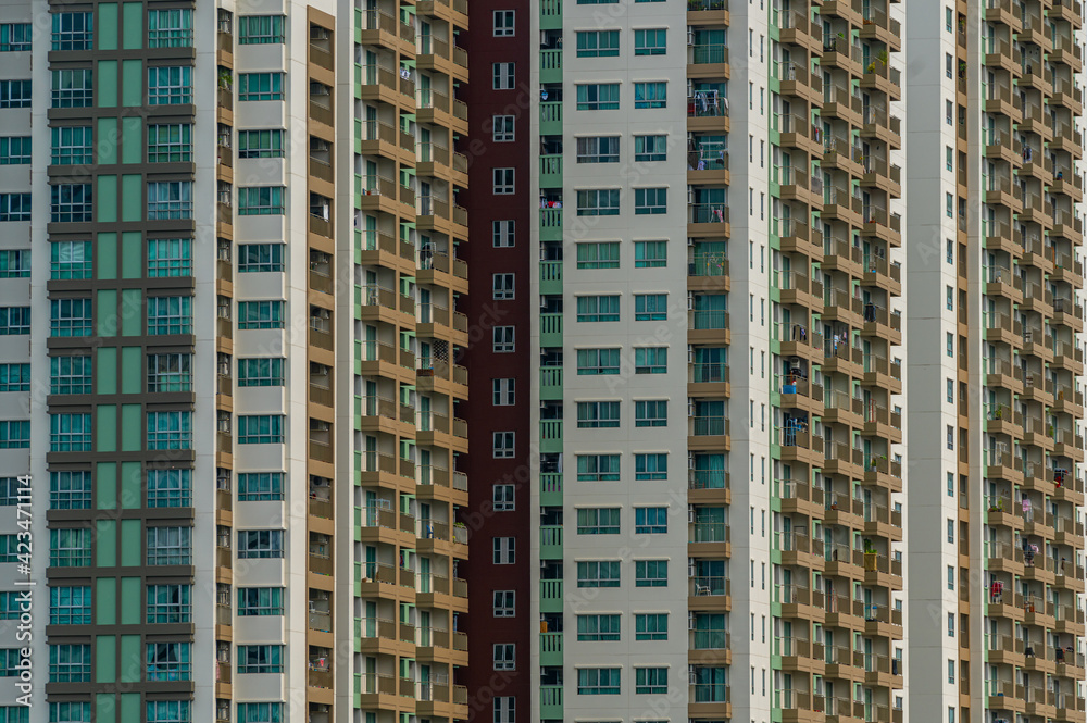 Beautiful pattern from many windows and balconies apartment building, Exterior building facade of modern apartments.