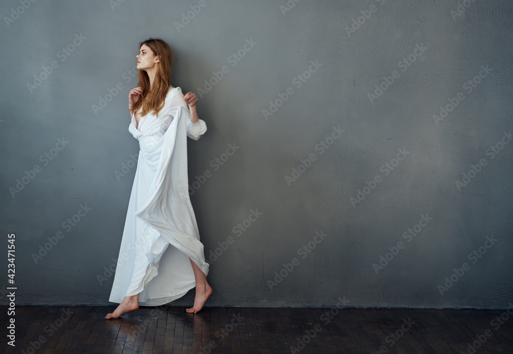 attractive woman white dress luxury performance studio gray background