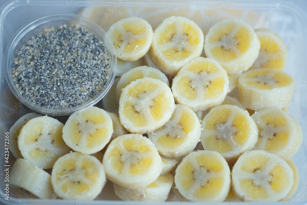 Delicious boiled banana served with black sesame mix sugar in box. Delicious boiled banana served with black sesame mix sugar in box.