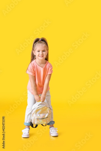 Cute little schoolgirl on c...