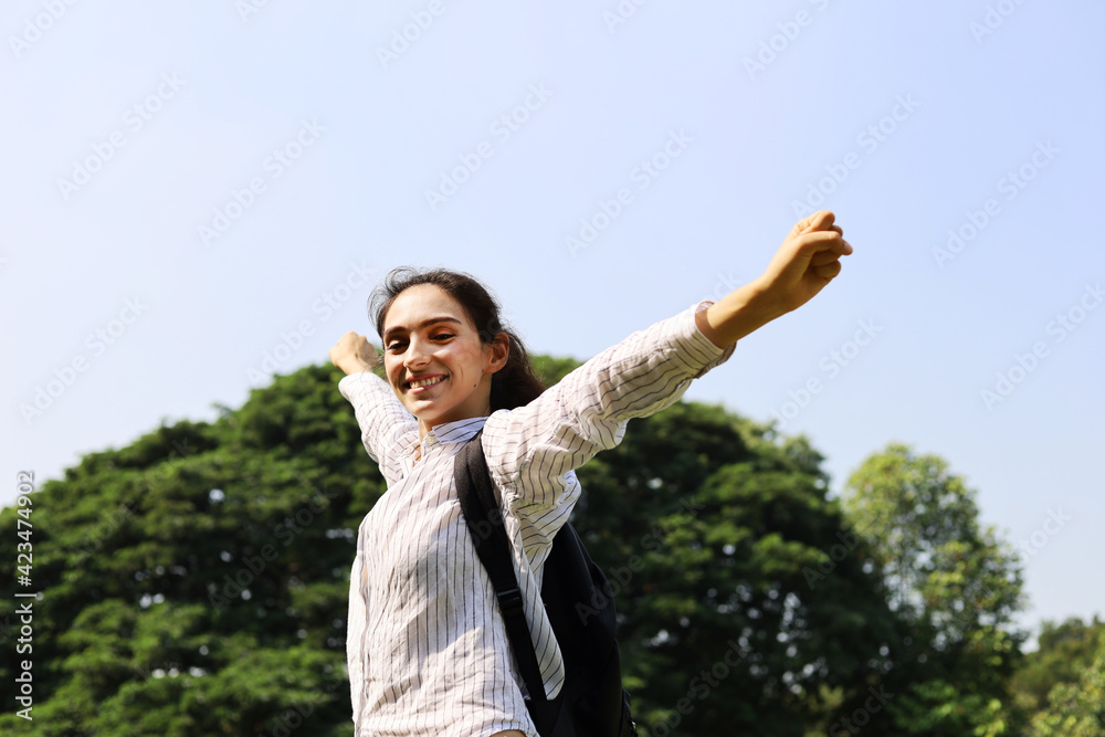 Happiness young woman smile freedom and relaxation at garden in holiday weekend. Happiness young woman smile freedom and relaxation at garden in holiday weekend.