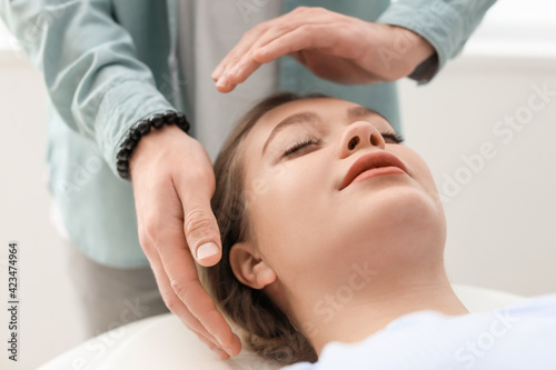 Reiki master working with patient