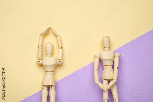 Wooden mannequins on color ...