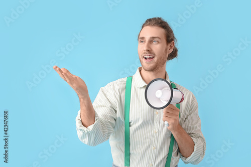 Young man with megaphone on...