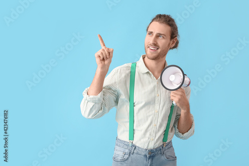 Young man with megaphone sh...