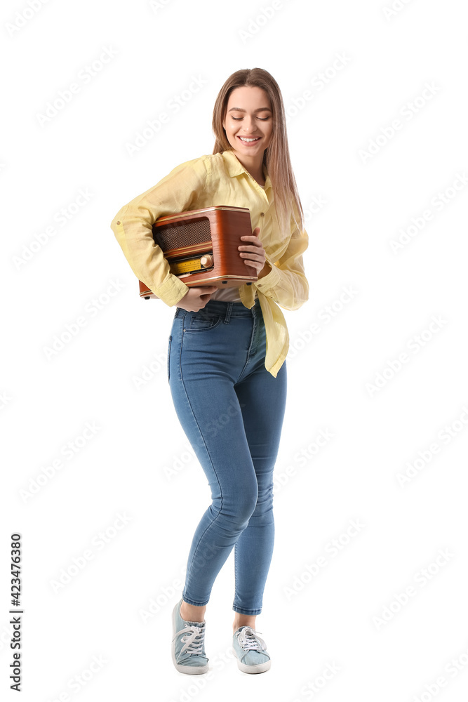 Young woman with retro radio receiver on white background Young woman with retro radio receiver on white background