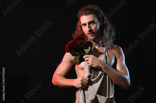 Naked young man with apron ...