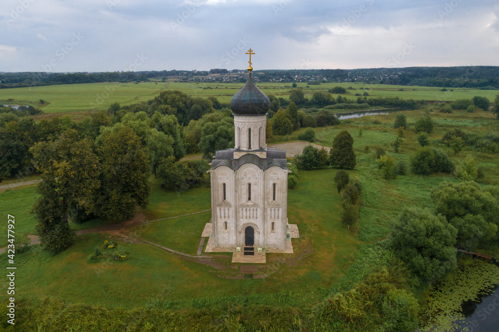 Medieval Church of the Intercession on the Nerl in the August morning (shooting from a quadcopter). Bogolyubovo, Russia
