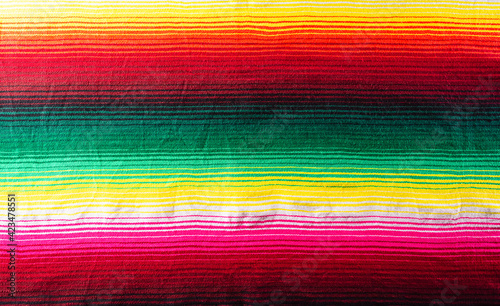 Cinco de mayo background decorated image made from mexican blanket stripes or poncho serape background.