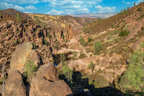 Rock formations in Pinnacles National Park in California, the destroyed remains of an extinct volcano on the San Andreas Fault. Beautiful landscapes, cozy hiking trails for tourists and travelers. photo