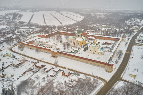 Scenic aerial view of old Kremlin in ancient russian town Zaraysk in Moscow oblast in Russian Federation. Beautiful winter look of old fortress in historical touristic russian town photo