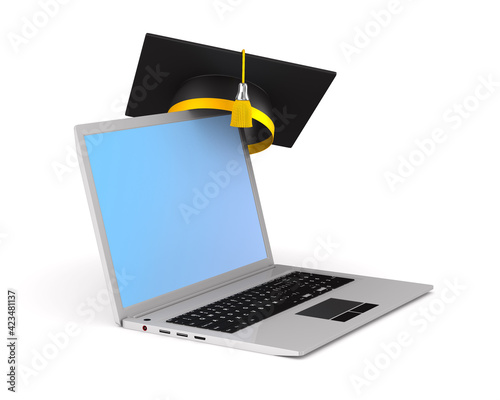 laptop and graduation cap o...