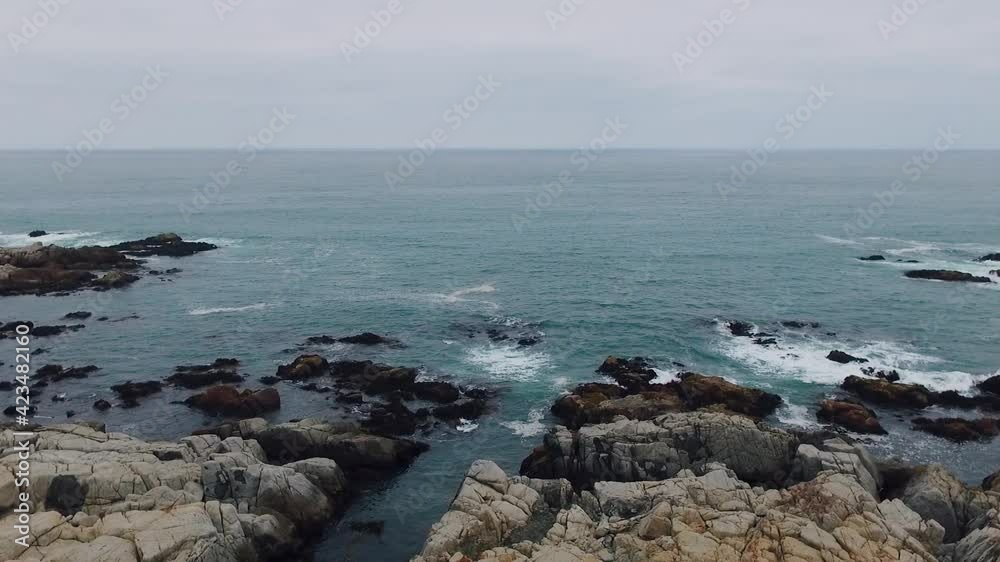 Aerial drone shot over the Chilean coast, cinematic and static stabilized video over the waves hitting the rocks Aerial drone shot over the Chilean coast, cinematic and static stabilized video over the waves hitting the rocks