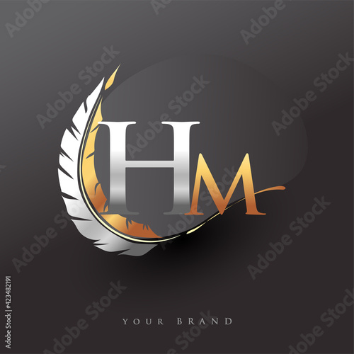 Initial letter HM logo with Feather Gold And Silver Color, Simple and Clean Design For Company Name. Vector Logo for Business and Company.