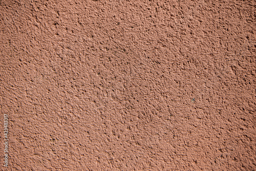 plaster texture of the outer wall of the building, teracotta red texture wall for backgrounds and copy space
