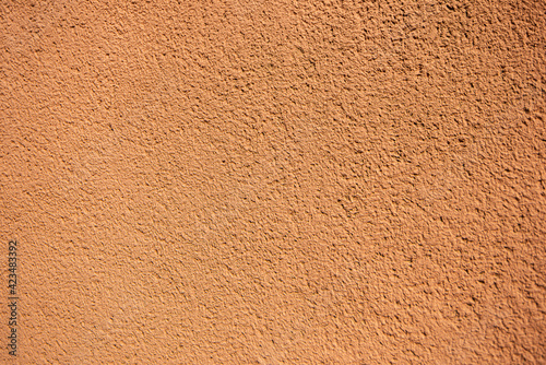 plaster texture of the outer wall of the building, teracotta red texture wall for backgrounds and copy space