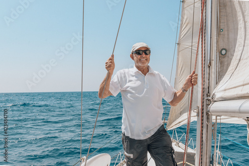 pensioneer on his yacht © detailblick-foto