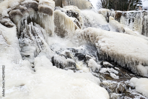 Partly frozen Keila-Joa waterfall in winter photo