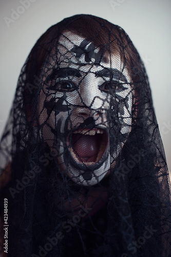 Girl screaming behind the veil