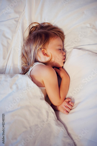 Beautiful baby sleeping in bed
