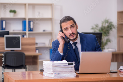 Young businessman employee working at workplace