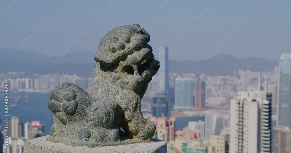 Victoria Peak, Hong Kong 05 February 2021: Hong Kong skyline with lion statue
