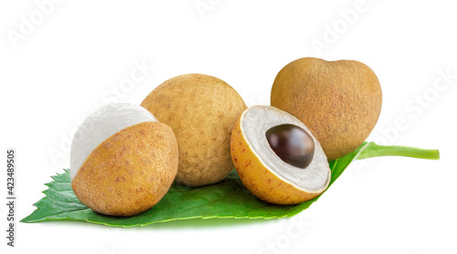 Longan with leaf isolated on white background. Tropical Longan fruit Close-up. Side view.