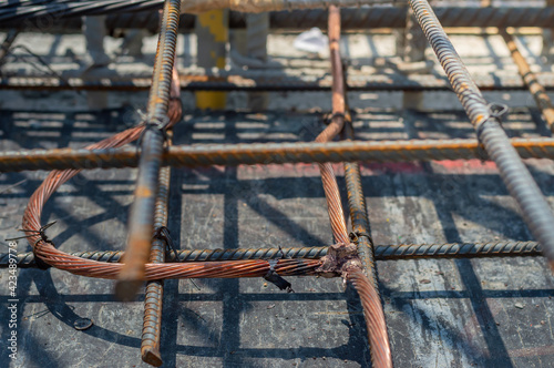 Welding copper ground wire on ground rod.Welding copper ground wire.Connect copper grounding lightning protection system. With the melting