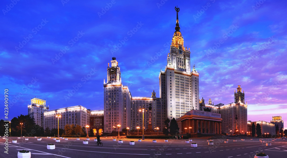 Fisheye panoramic evening view of nicely illuminated famous Russian university under dramatic sunset sky