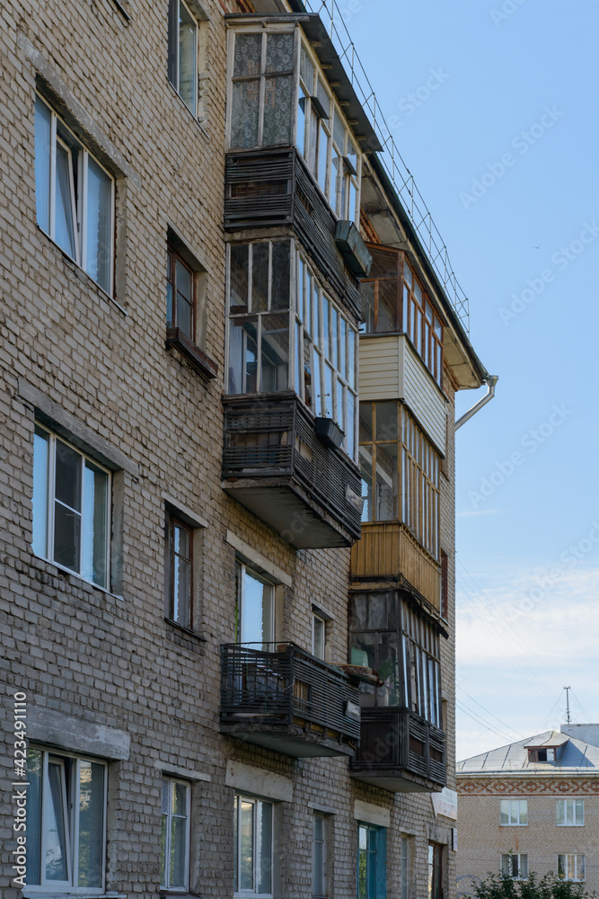 Fototapeta premium July 20, 2017: Photo of an old collapsing multi-apartment brick house. Cheboksary. Russia.