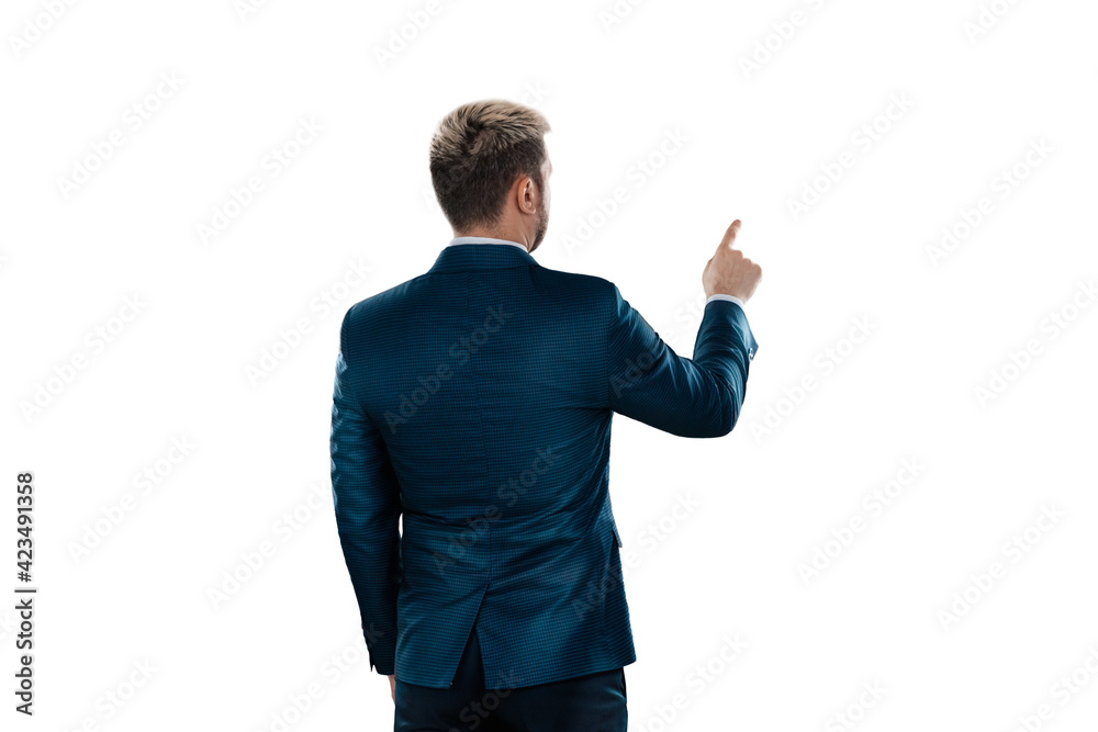 A man, a businessman in a business suit is isolated on a white background, points at something with his finger. A man, a businessman in a business suit is isolated on a white background, points at something with his finger.