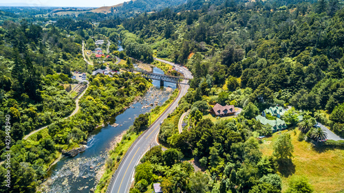 The road running across a mountain river in a beautiful little valley. Coromandel, New Zealand.