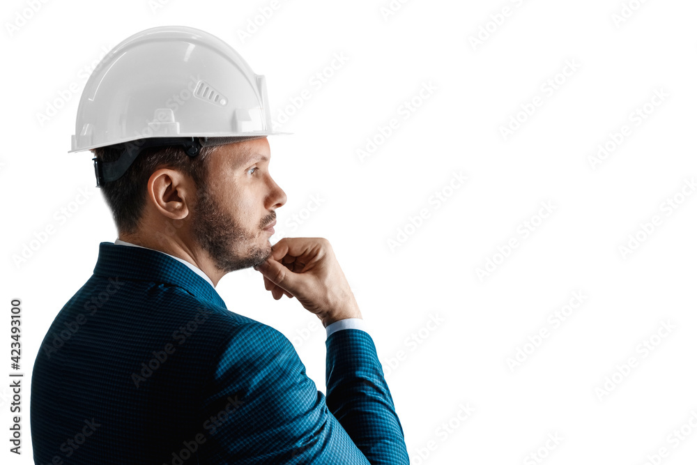 A man in a business suit, an architect with a white helmet on his head close-up, isolated on a white background. The concept of architecture, construction, blueprints, plan. A man in a business suit, an architect with a white helmet on his head close-up, isolated on a white background. The concept of architecture, construction, blueprints, plan.